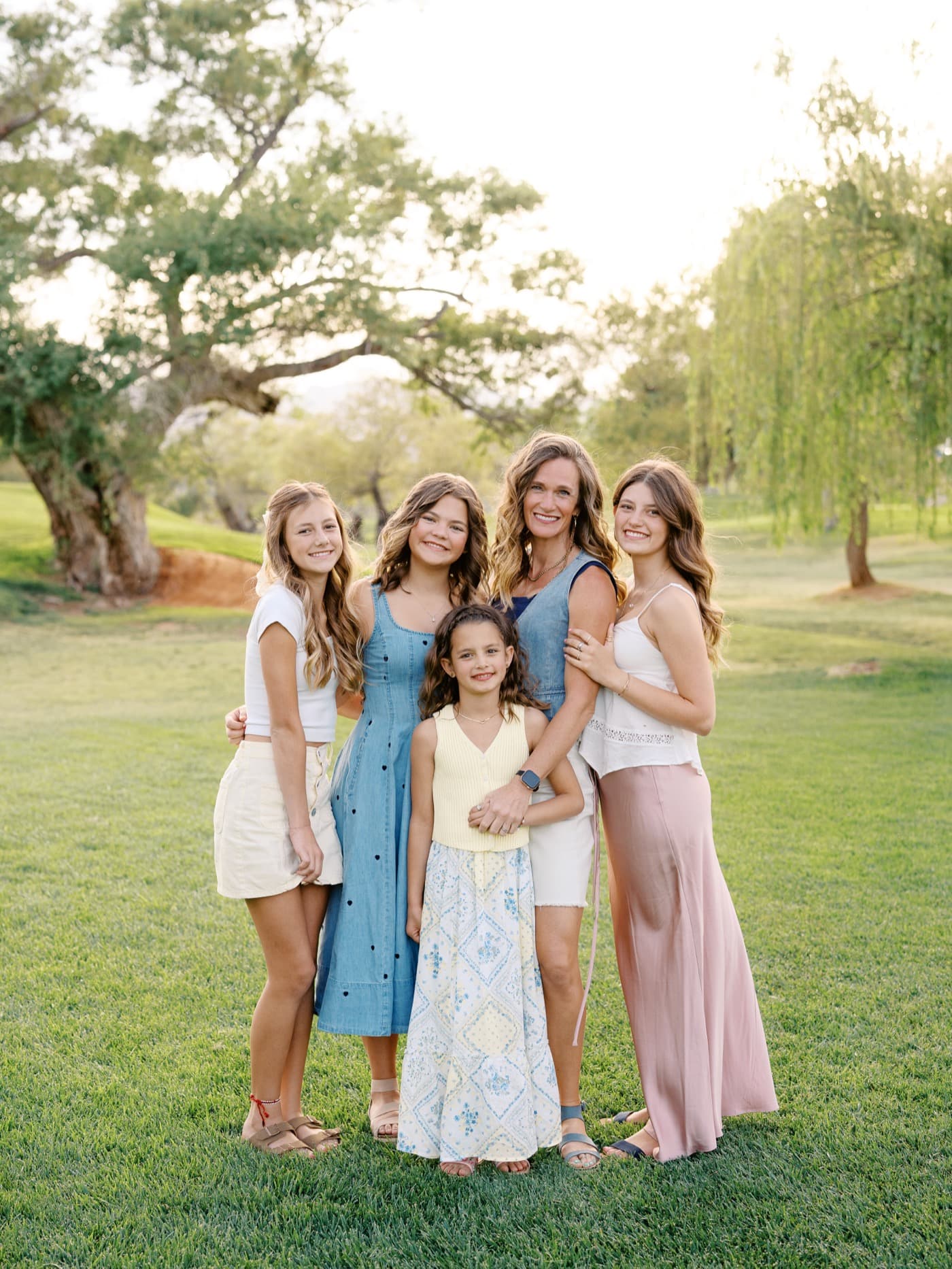 Natalie with her daughters in a field