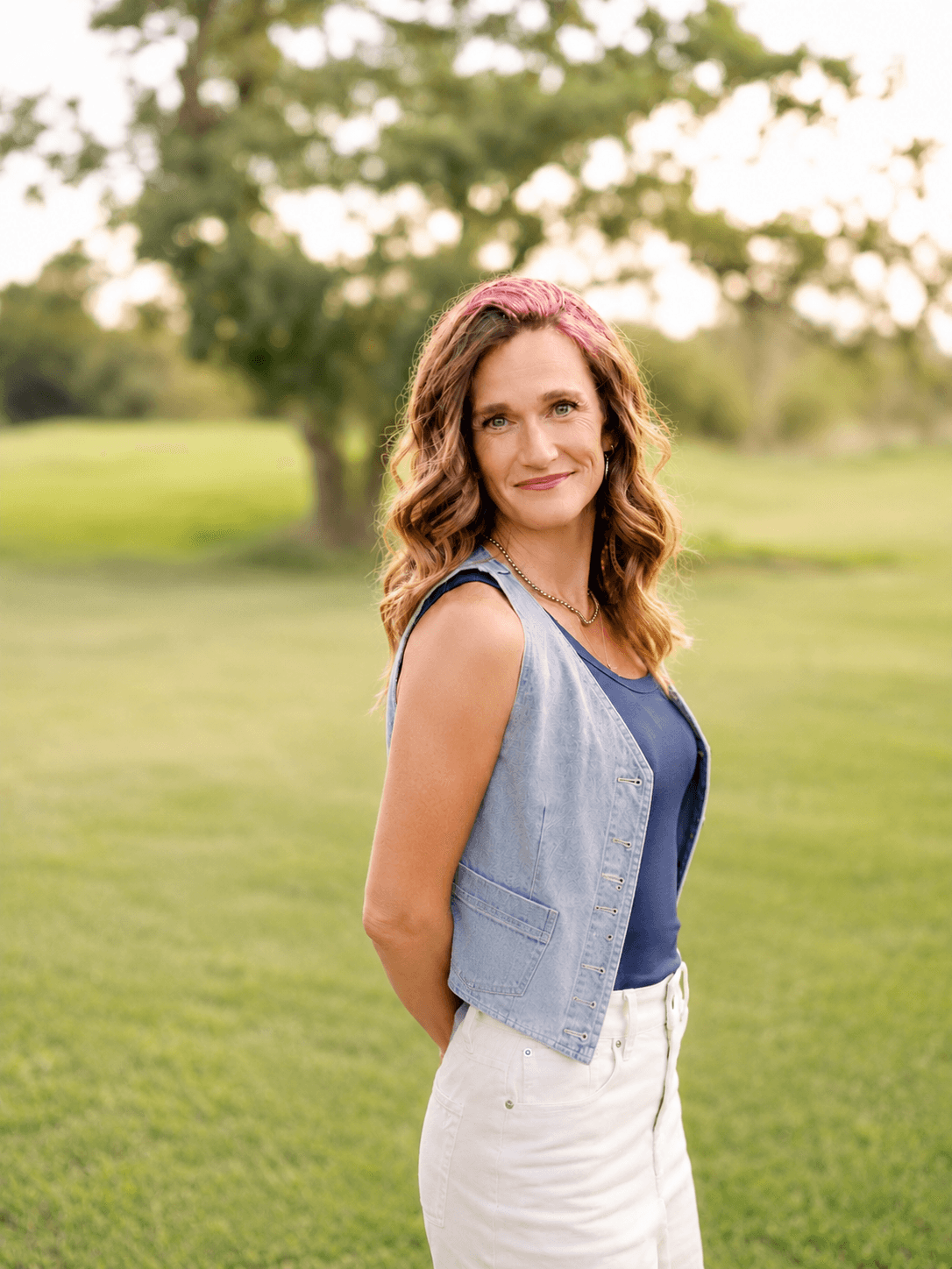Natalie standing in soft outdoor light